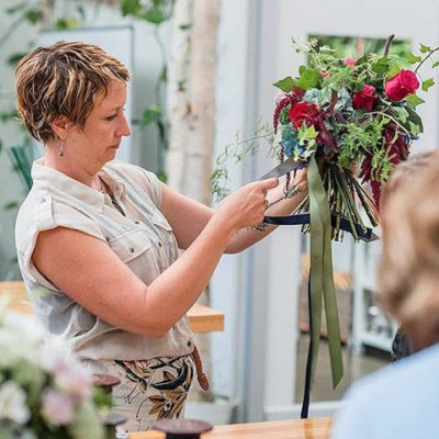 Women fixing flowers